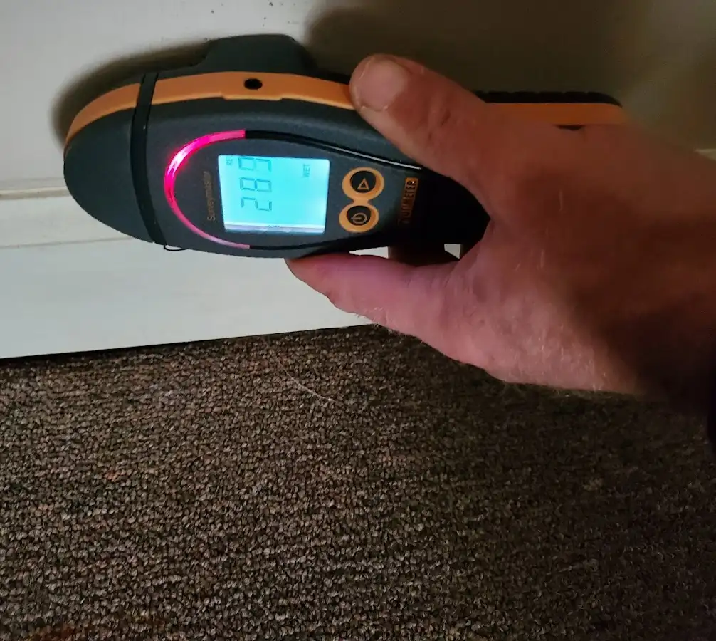 Moisture detection at baseboard during Storm Damage Restoration in Princeton